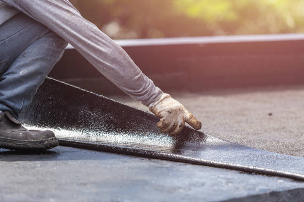 Professional Basement Waterproofing technician working in Heltonville, IN